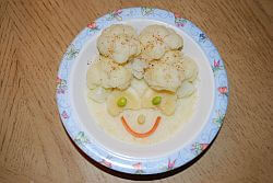 Potato and turnip puree for baby, decorated with veggies
