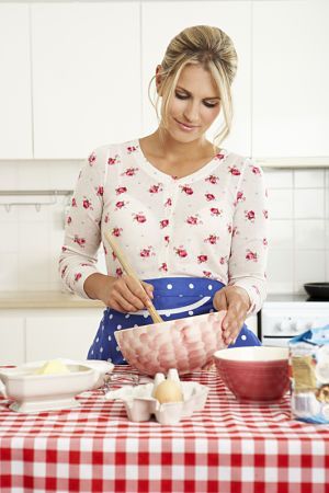 A woman making sugar free frosting - ideal for your baby's first birthday cake!